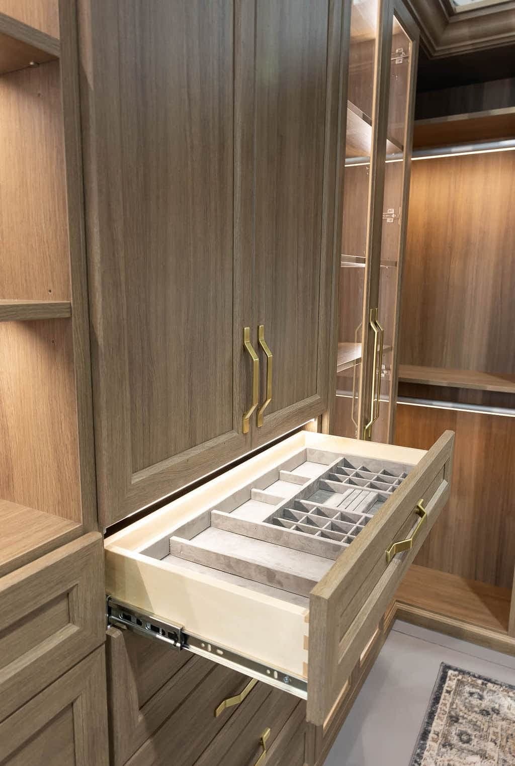 Organized-space inspiration: a lit drawer with a divided jewelry and accessory insert