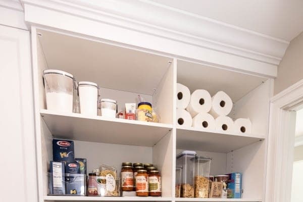 Organized-space inspiration: pantry shelving holding dry goods, jars and supplies